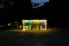 A public bathroom designed as part of the Tokyo Toilet art project is illuminated at night